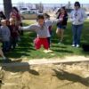 <?php echo Track Meet: Angel leaping through the air at the long jump; ?>