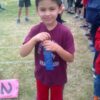 <?php echo Track Meet: Angel showing off his 1st place ribbon for the 50m race; ?>